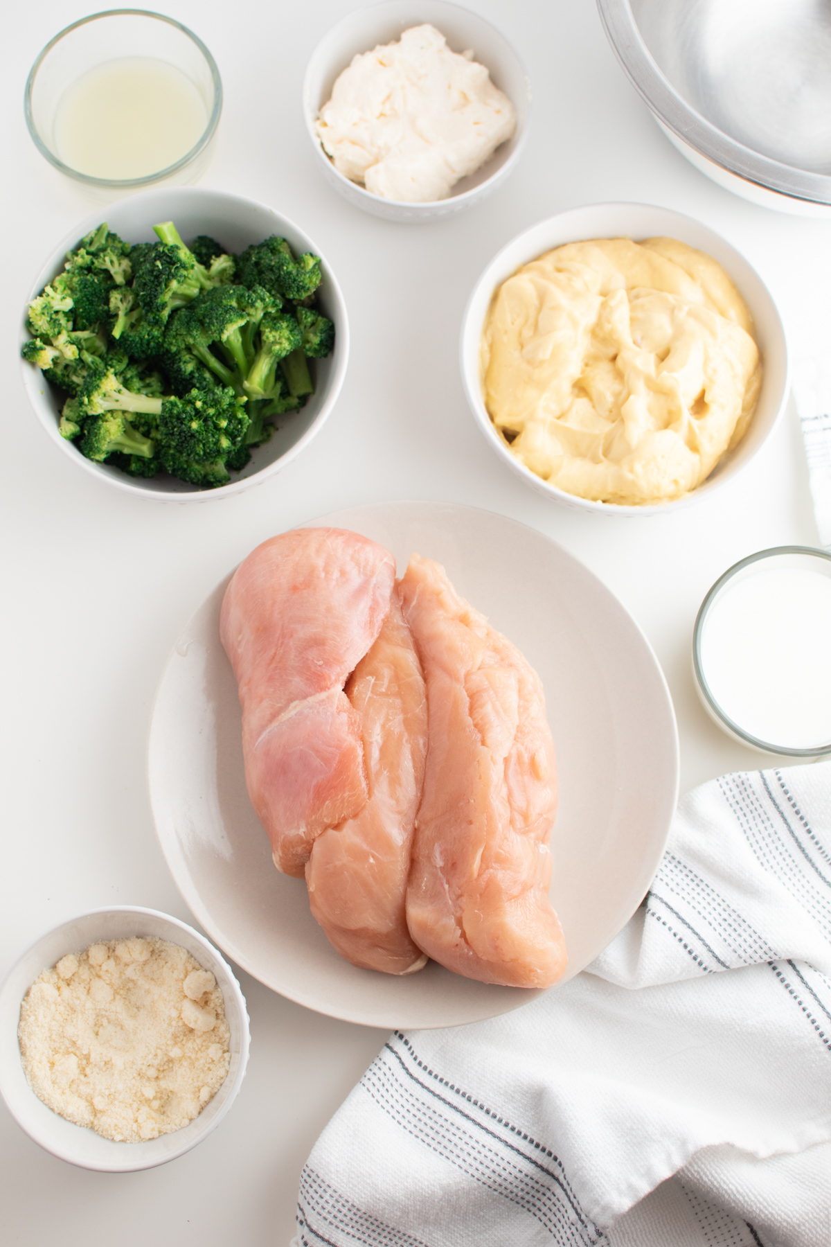 Chicken broccoli casserole ingredients including chicken breasts, cream of chicken soup and broccoli.
