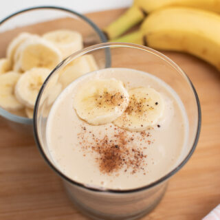 Banana and ice smoothie in glass.