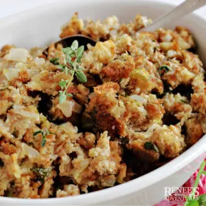 Sage and onion stuffing in white bowl.