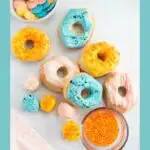 Pinterest graphic with text and several air fryer biscuit donuts arranged on table top.
