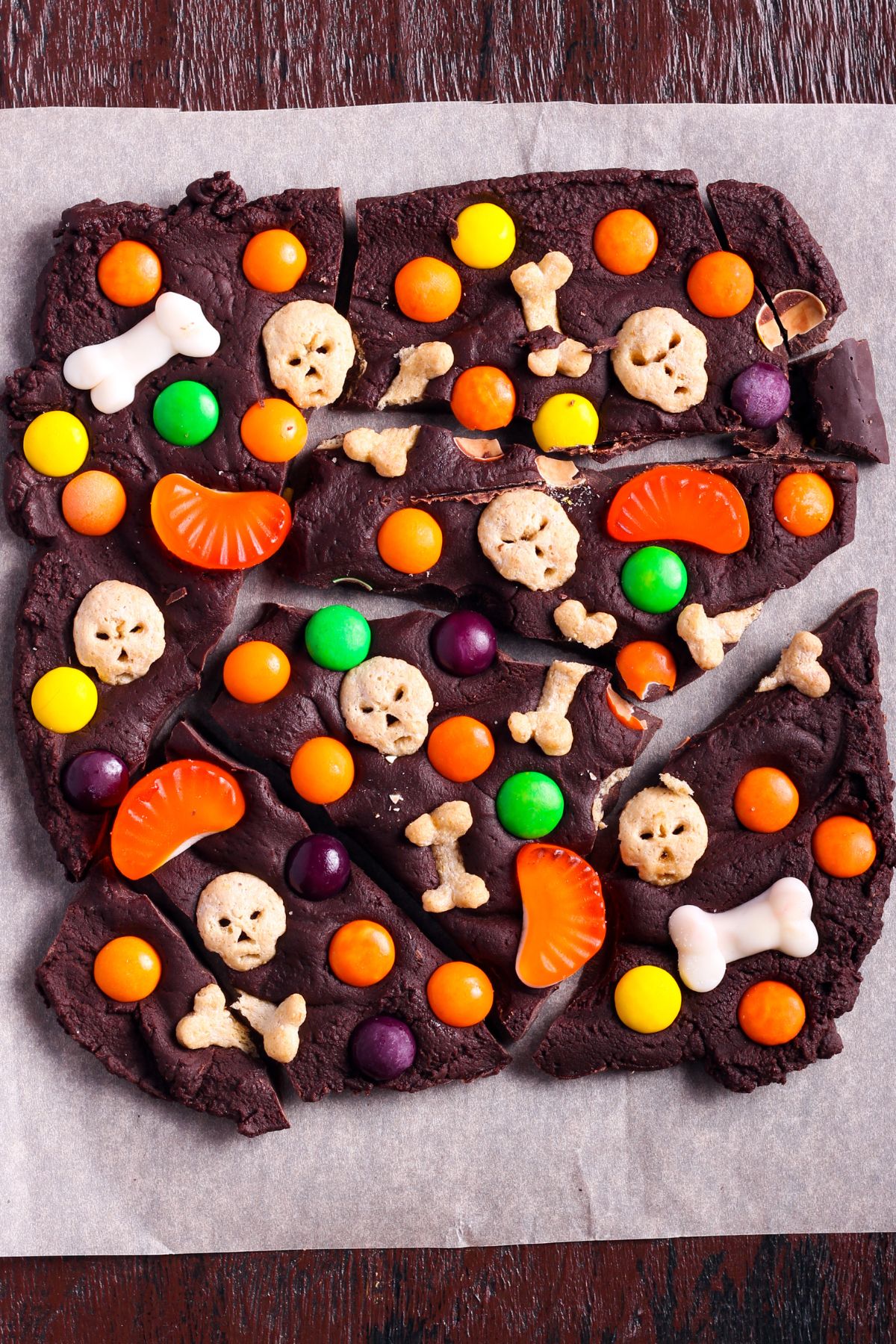 Halloween chocolate bark with assorted candies including bones and skulls.