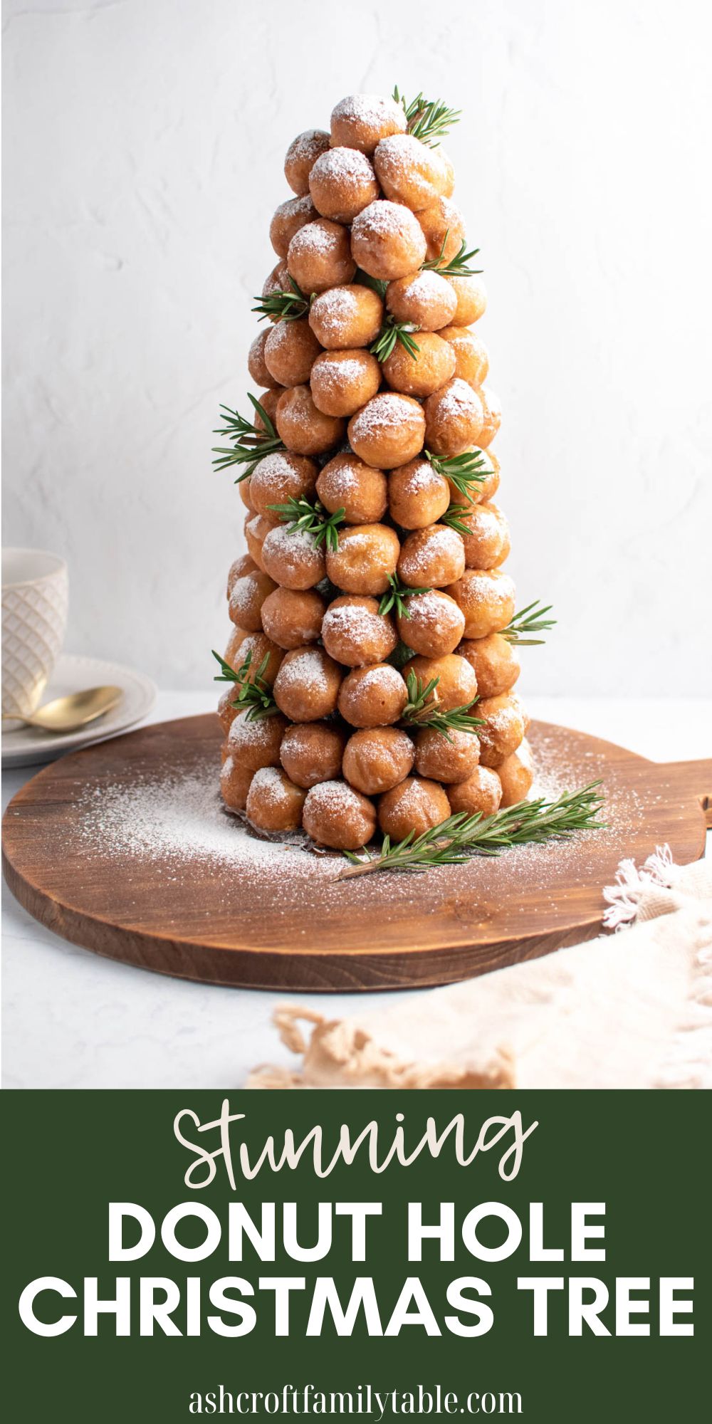 Pinterest graphic with text and photo of donut hole Christmas tree with fresh rosemary.