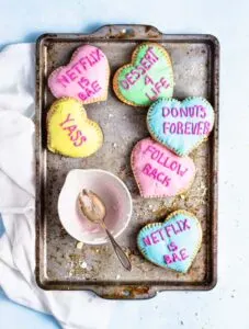 Valentine's day conversation hearts pop tarts on a metal baking dish.