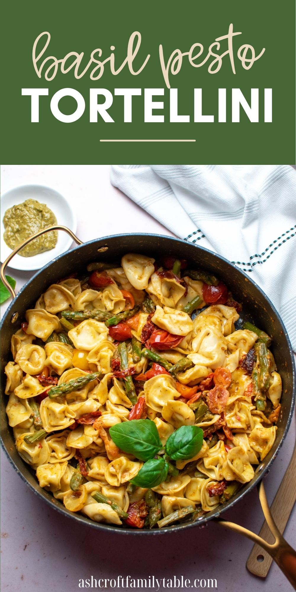 Pinterest graphic with text overlay and photo of black skillet full of basil pesto tortellini.