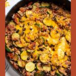 Pinterest graphic with text and photo over skillet with black bean and zucchini dinner.