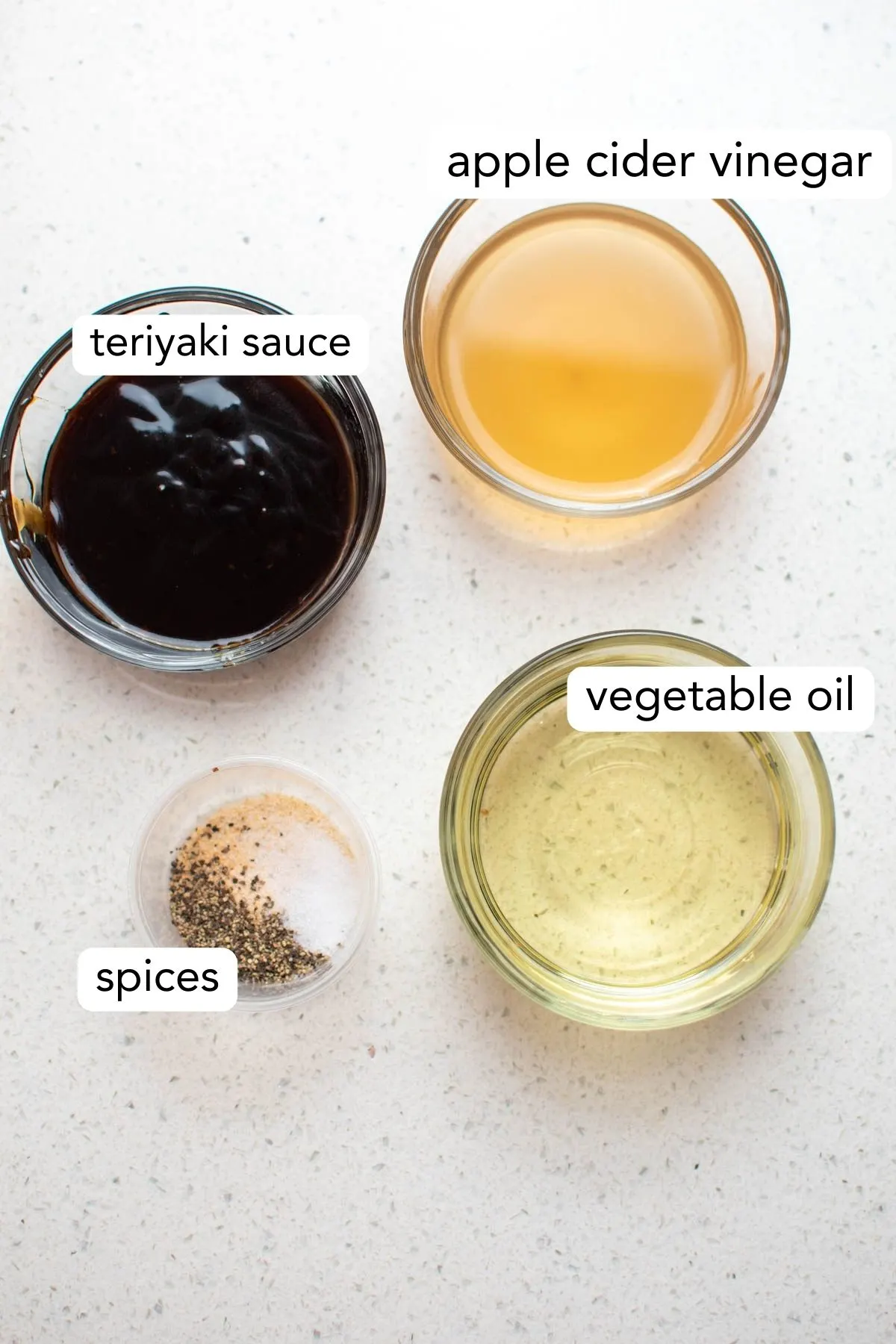 Labeled photo of different bowls of Asian salad dressing ingredients.