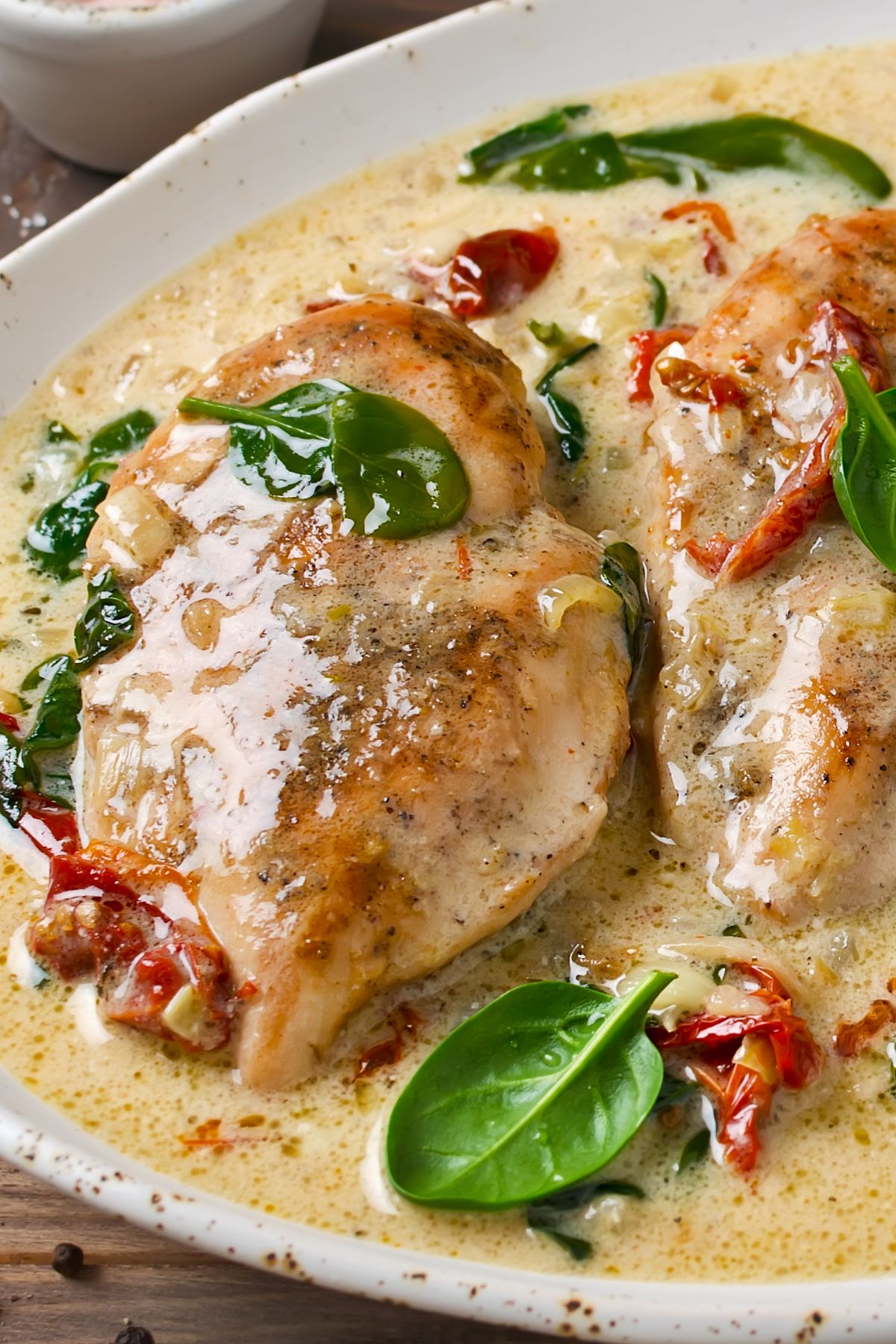 "Marry Me" chicken thighs covered in a creamy sun-dried tomato sauce.