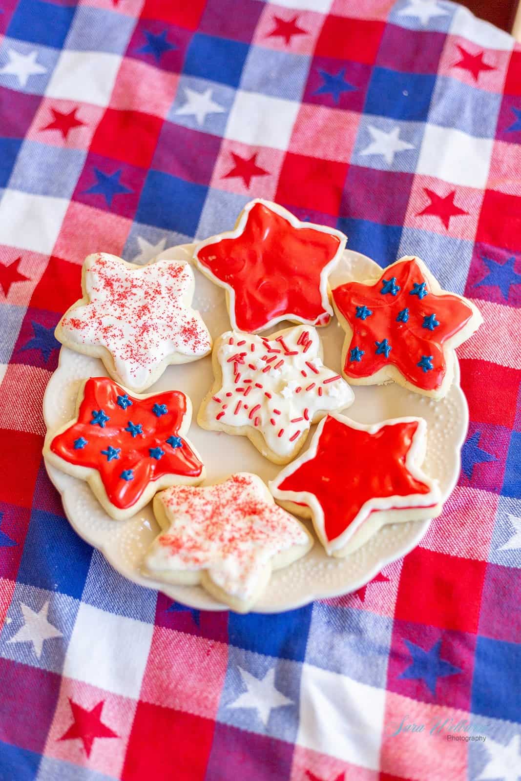 Patriotic star-shaped cookies on a white plate.