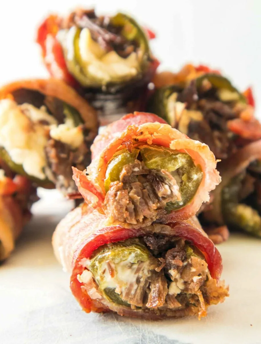 A pile of Texas twinkies (bacon-wrapped, brisket-stuffed jalapeno poppers).