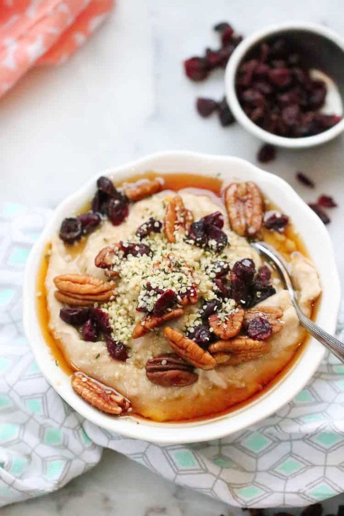 Vegan buckwheat porridge bowl with pecans and hemp seeds.