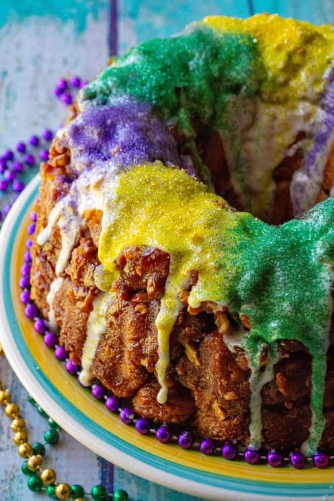Monkey bread King cake with purple, green, and yellow icing.
