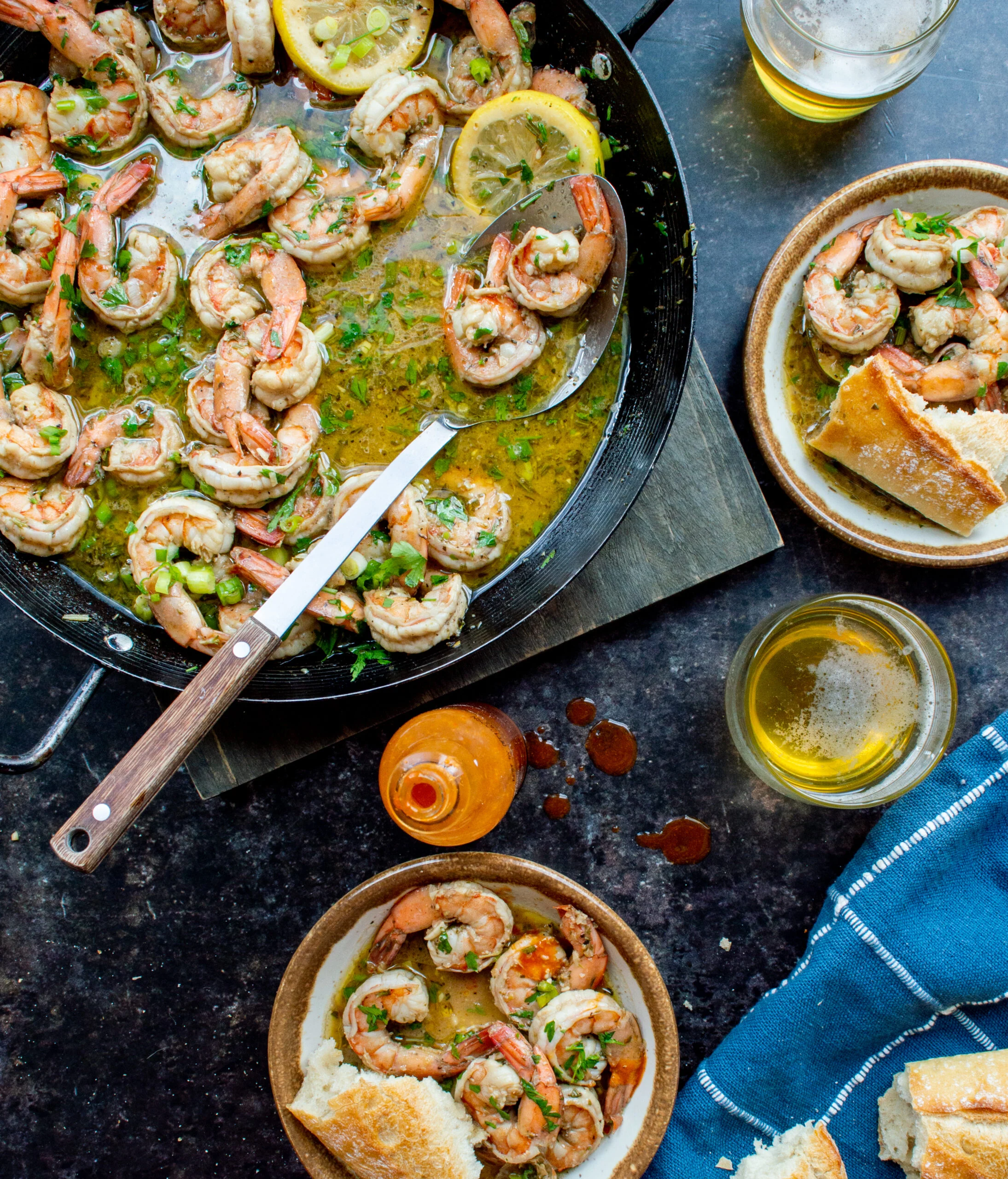 BBQ shrimp New Orleans-style in a cast iron skillet.