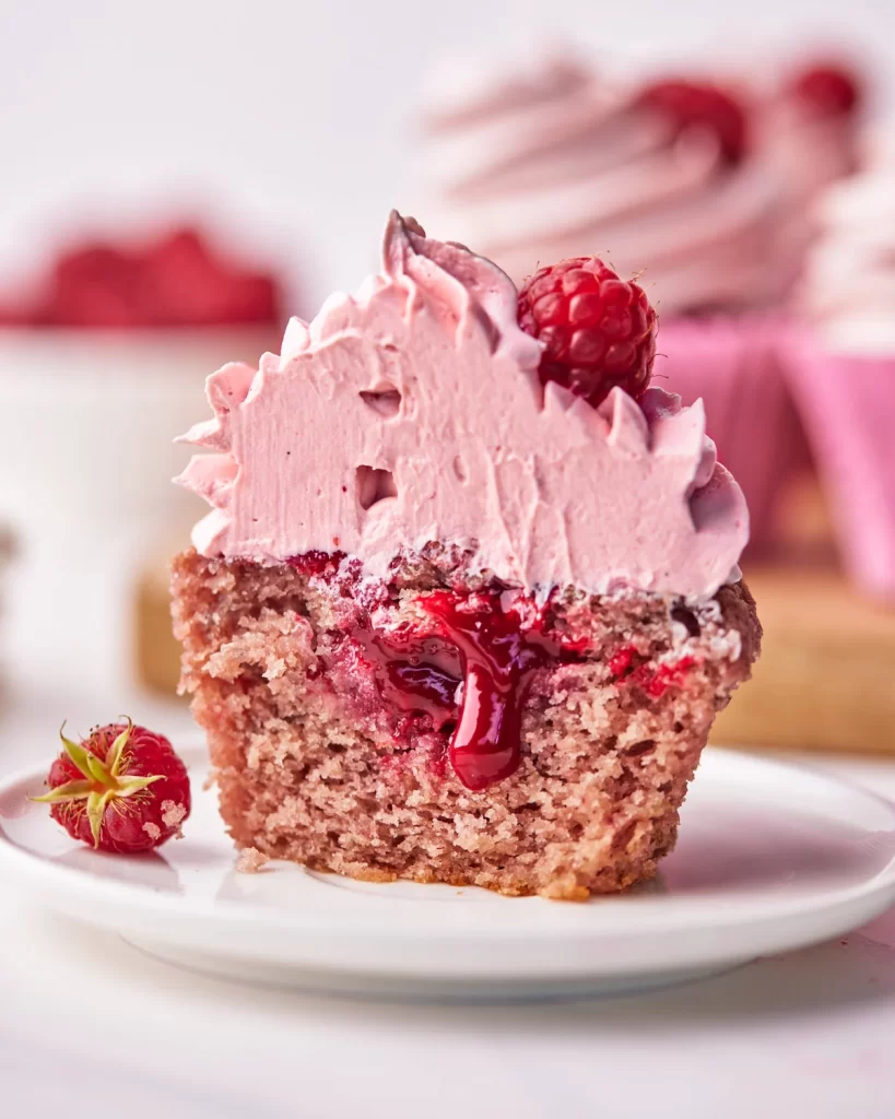 Raspberry filled raspberry cupcakes with raspberry frosting.