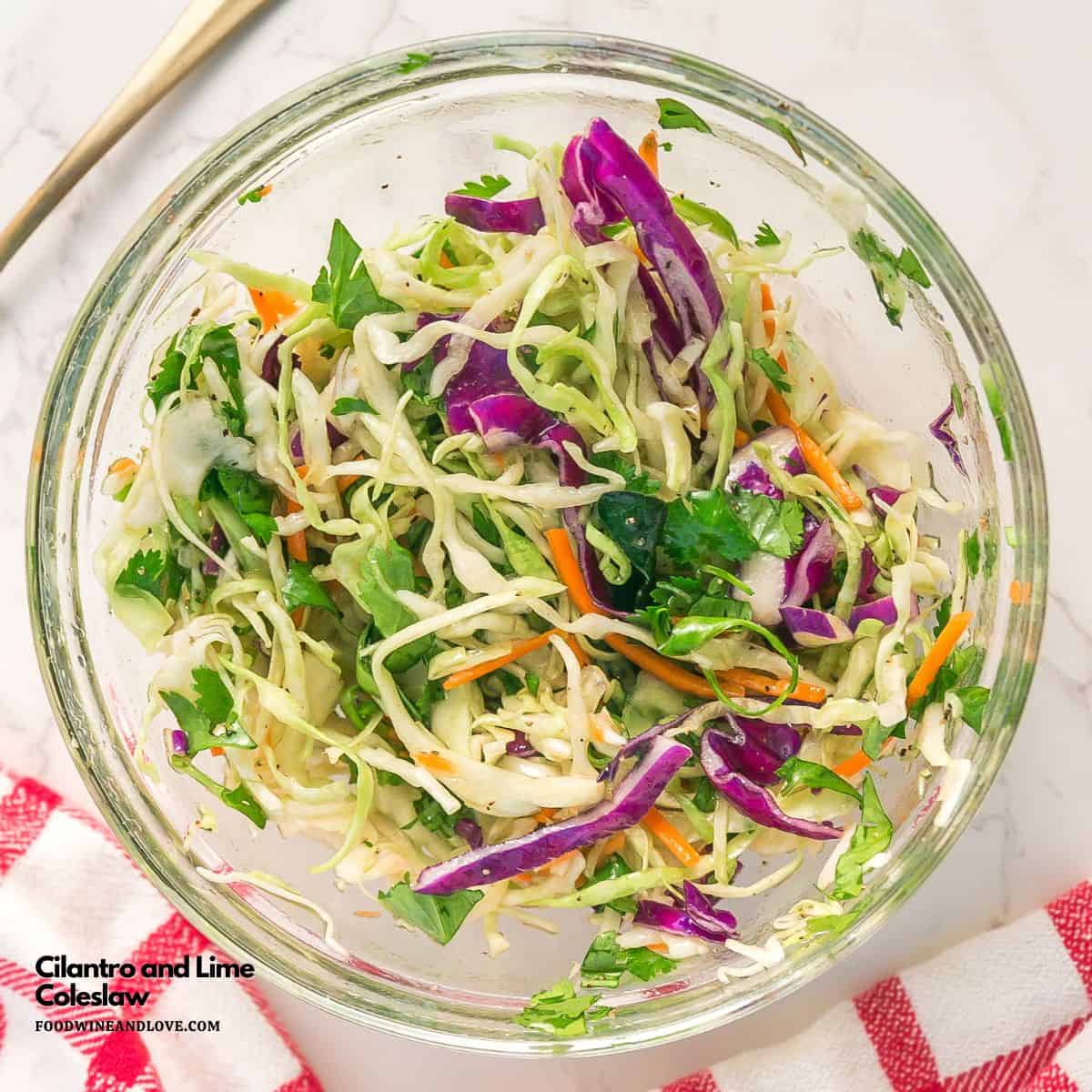 Cilantro lime coleslaw in a glass bowl.