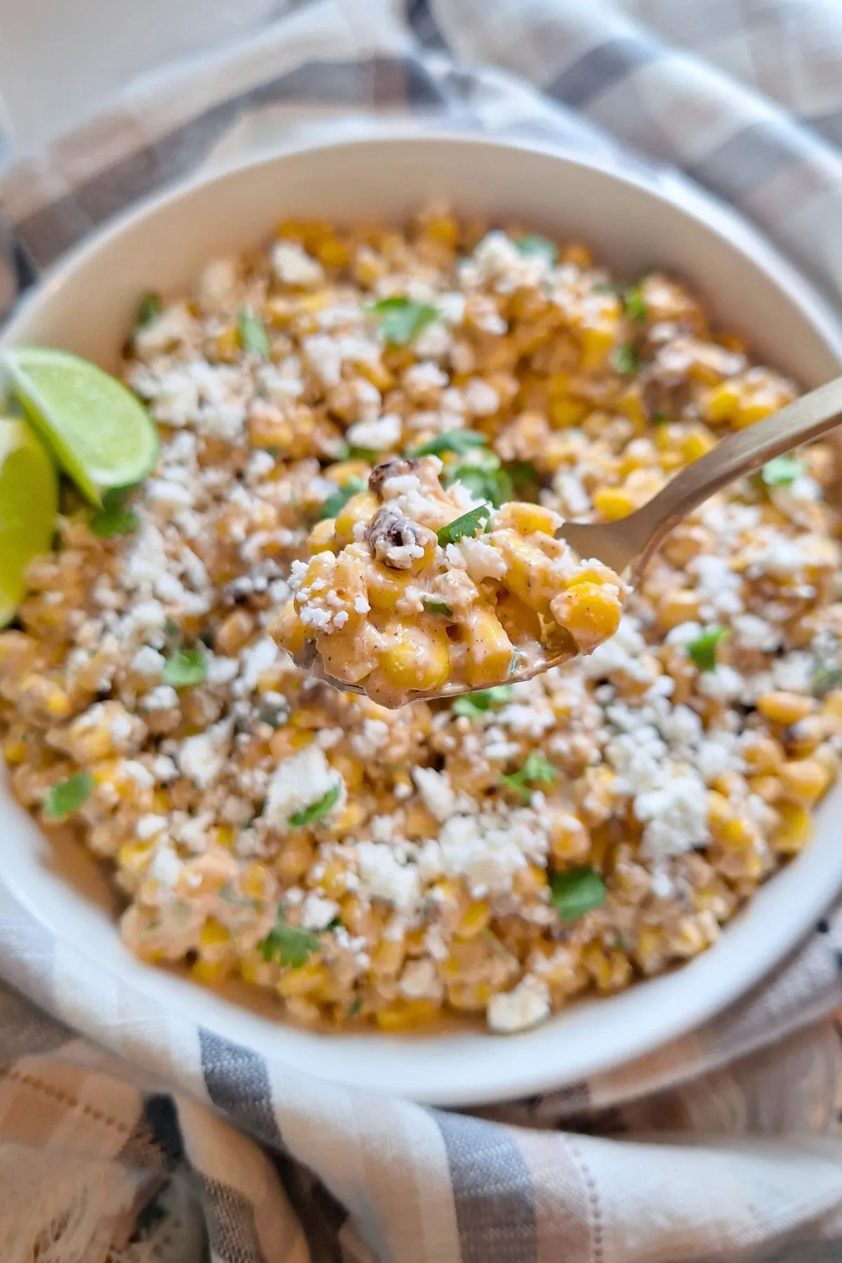 Mexican street corn with cilantro in a large serving bowl.