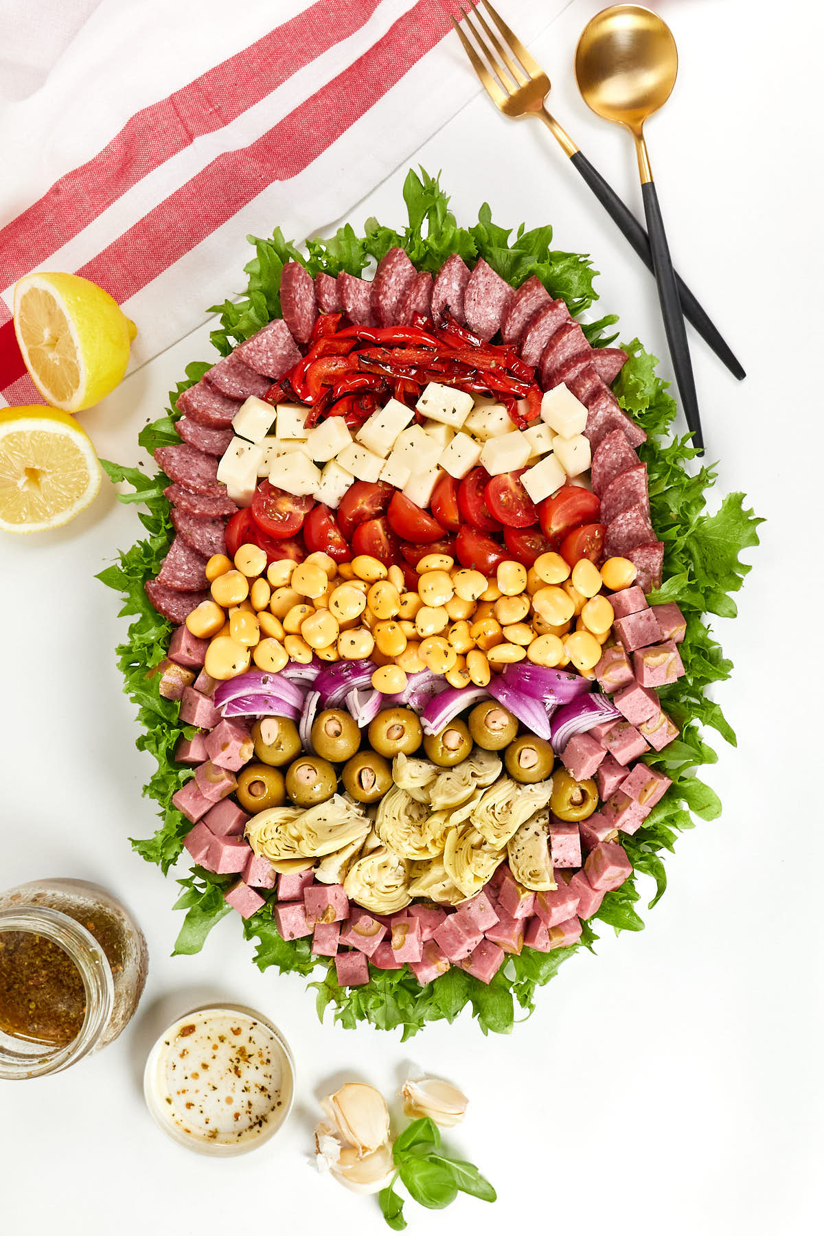 Antipasto lupini bean salad with sections of ingredients.