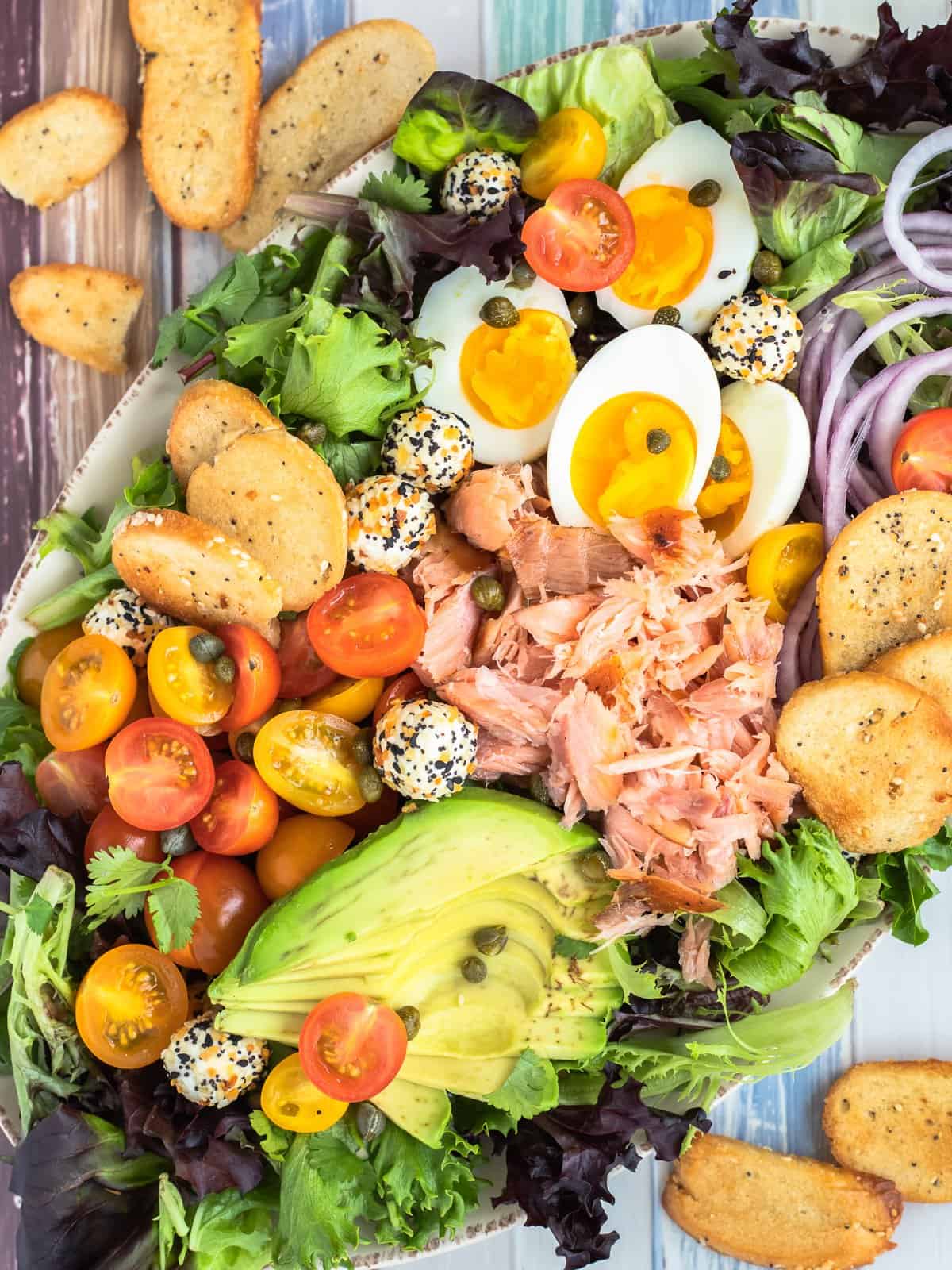 Smoked salmon salad with everything bagel dressing, croutons, and boiled eggs.