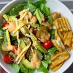 Pinterest graphic with text for a turkey burger bowl with pickles, tomatoes, cheese, and special sauce.