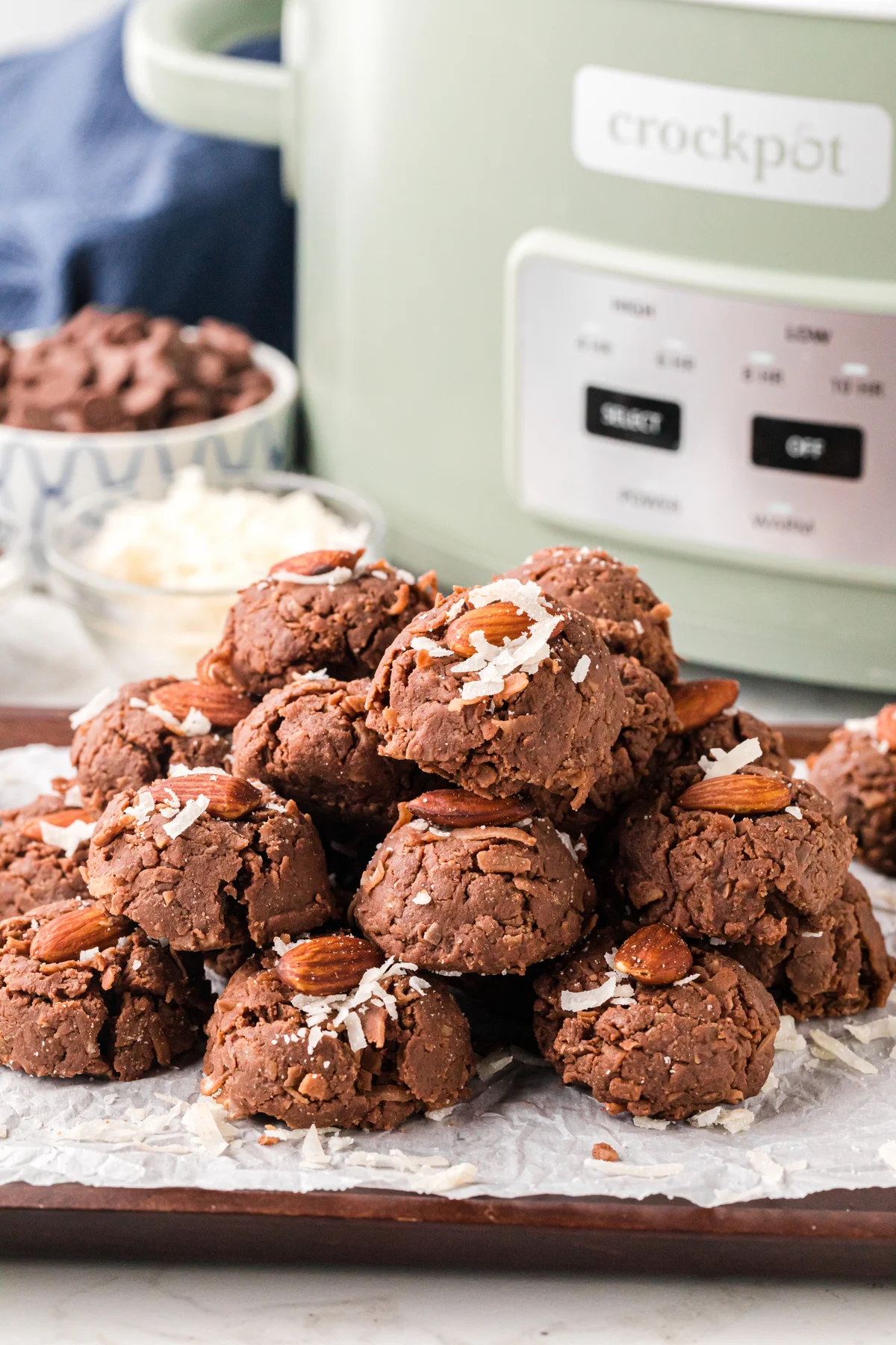 Almond crockpot candy with shredded coconut on top.