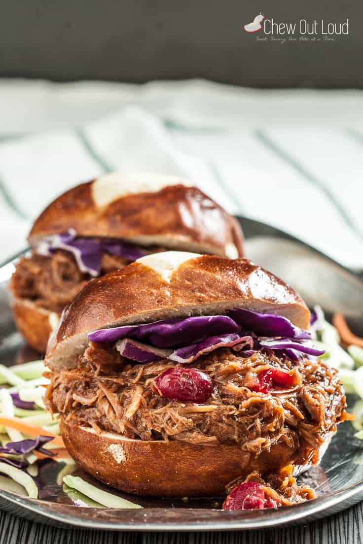 Cranberry pulled pork sandwiches with purple cabbage.